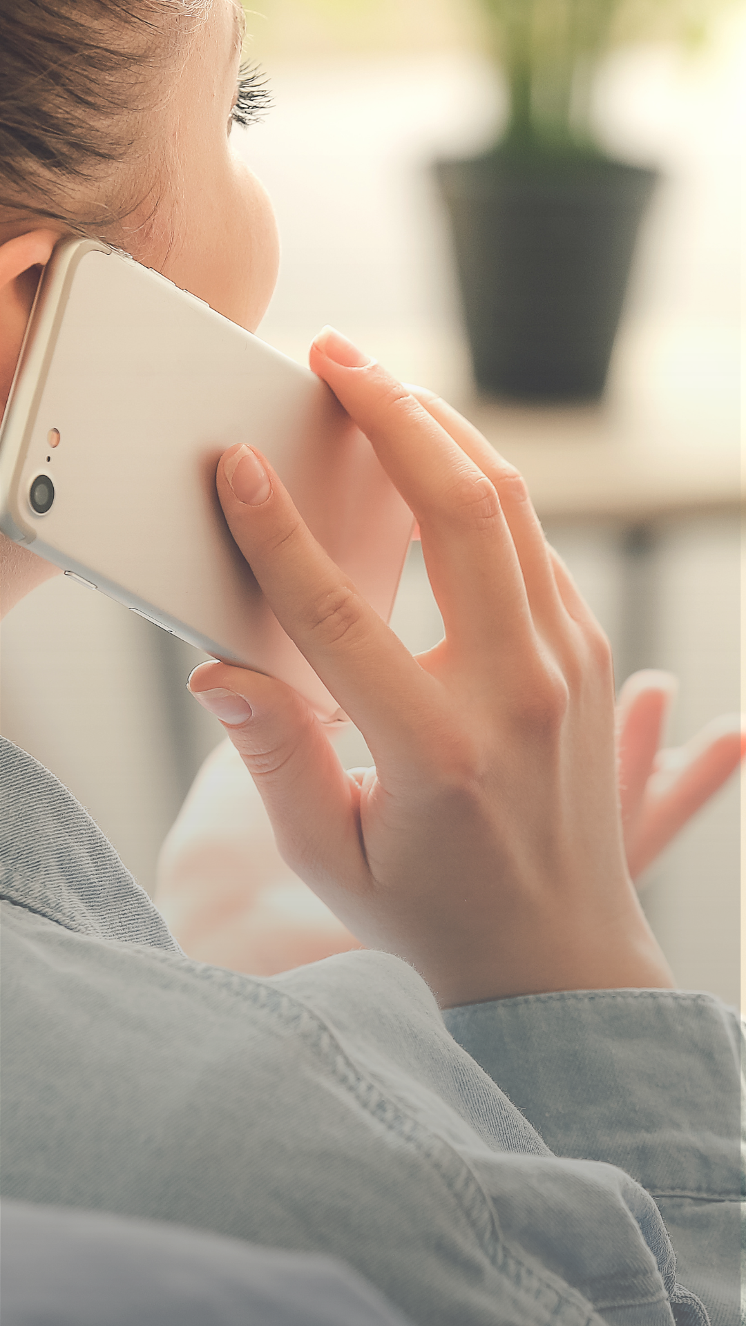 A woman making a call on a mobile phone.